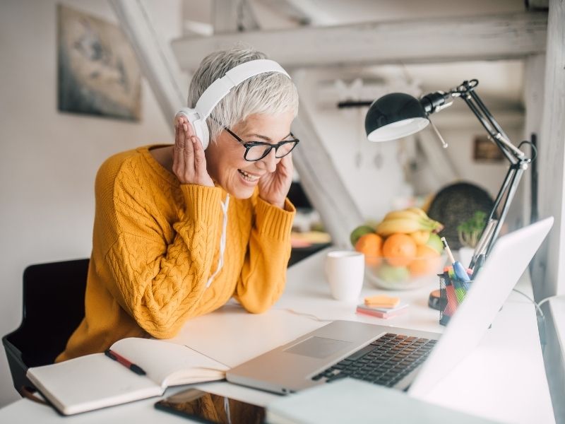 happy woman learning wellbeing program